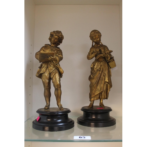 65 - 19thC Gilded Spelter figures of a Boy and girl reading mounted on wooden turned bases