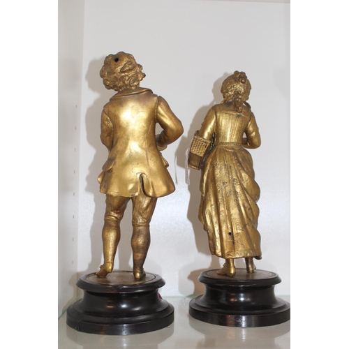 65 - 19thC Gilded Spelter figures of a Boy and girl reading mounted on wooden turned bases