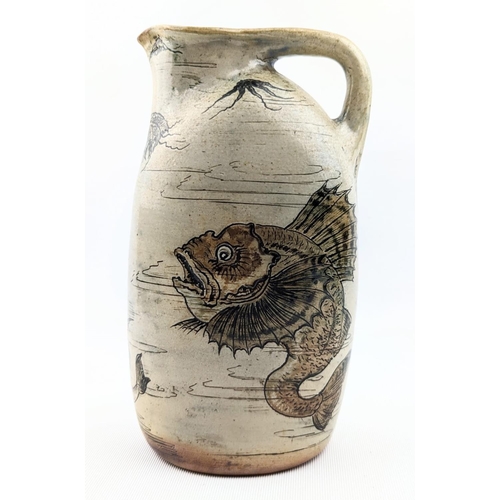 10 - A Martin Brothers Stoneware Aquatic ewer, dated 1896, shouldered, oval bodied graduated handle model... 