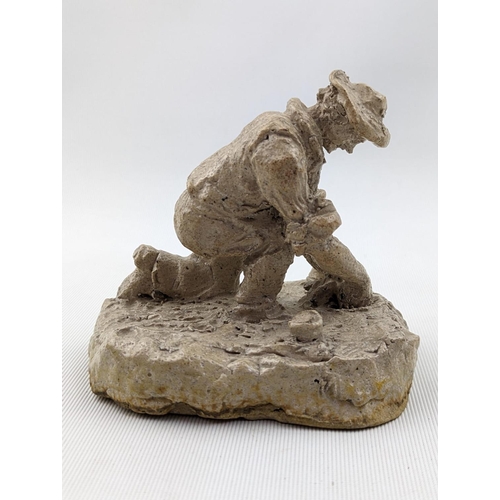 12 - Rare Martin Brothers figure of The Gardener by Robert Wallace Martin. Depicting a man kneeling plant... 