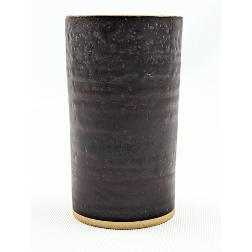 7 - Dame Lucie Rie D.B.E (1902-1995) a stoneware cylindrical vase, the exterior bronze the interior off ... 