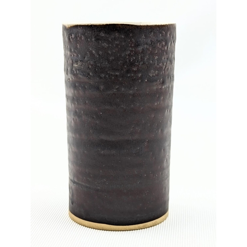 7 - Dame Lucie Rie D.B.E (1902-1995) a stoneware cylindrical vase, the exterior bronze the interior off ... 