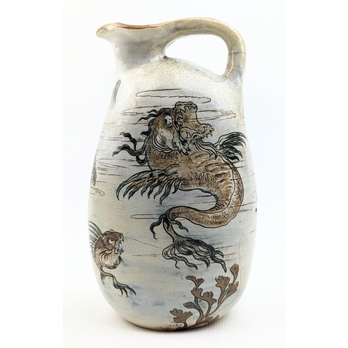 9 - A Martin Brothers Stoneware Aquatic ewer, dated 1896, shouldered, oval bodied graduated handle model... 