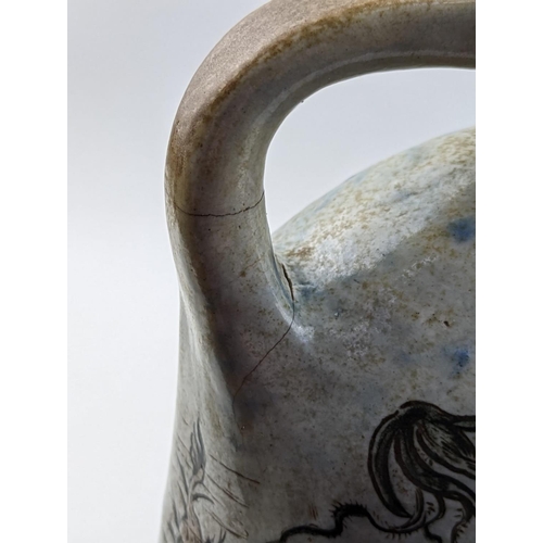 9 - A Martin Brothers Stoneware Aquatic ewer, dated 1896, shouldered, oval bodied graduated handle model... 