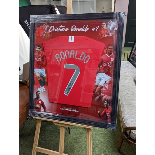 100 - Christiano Ronaldo Man United & Shirt signed. COA from HTC Memorabilia item 3071. 73 x 83cm