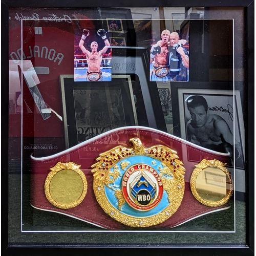 104 - Ryan Rhodes WBO world championship belt framed. 64 x 63cm total size