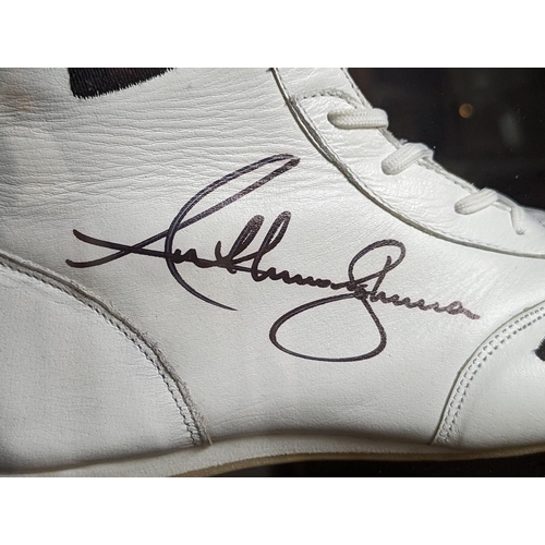 78 - A framed and signed replica boxing boot signed by Anthony Joshua. Please note: this is a replica boo... 