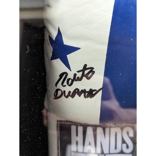 99 - Roberto Duran 'Hands of Stone' Signed Boxing Glove. COA to reverse 5th King Memorabilia. 44 x 58cm t... 