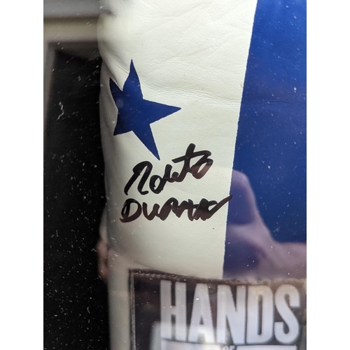 99 - Roberto Duran 'Hands of Stone' Signed Boxing Glove. COA to reverse 5th King Memorabilia. 44 x 58cm t... 