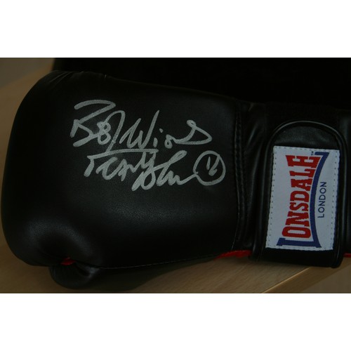 45 - A Frank Bruno personally signed Lonsdale boxing glove in presentation case.