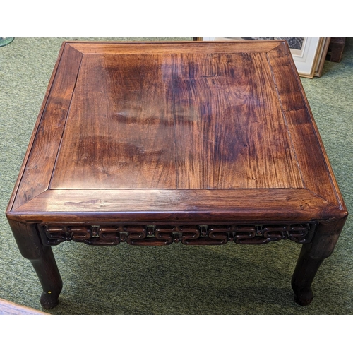 211 - A CHINESE HUANGHUALI LOW TABLE CIRCA 1900
The square top with inset plank panel over carved pierced ... 