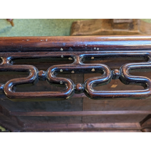 211 - A CHINESE HUANGHUALI LOW TABLE CIRCA 1900
The square top with inset plank panel over carved pierced ... 