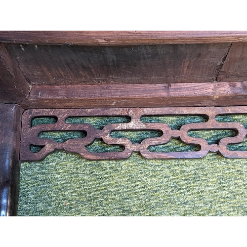 211 - A CHINESE HUANGHUALI LOW TABLE CIRCA 1900
The square top with inset plank panel over carved pierced ... 