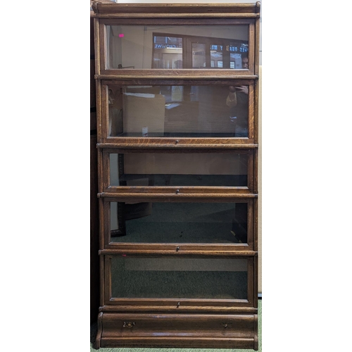 219 - 5 Stack Oak Barristers bookcase with coppered fittings, drawer to base. 182cm tall by 86cm wide by 2... 