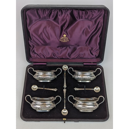 231 - Cased Set of 4 Silver fluted Salts with matching Spoons retailed by Carrington & Co of Regents Stree... 