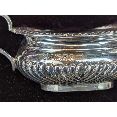 231 - Cased Set of 4 Silver fluted Salts with matching Spoons retailed by Carrington & Co of Regents Stree... 