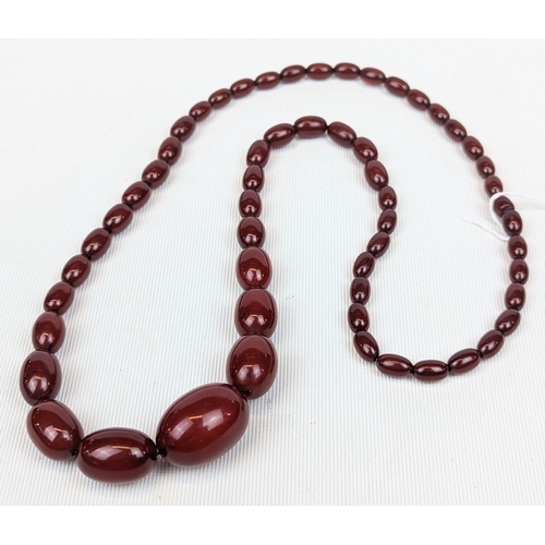 250 - Good quality Cherry Amber graduated necklace of 57 Beads from 3cm to 0.5cm. 70g total weight