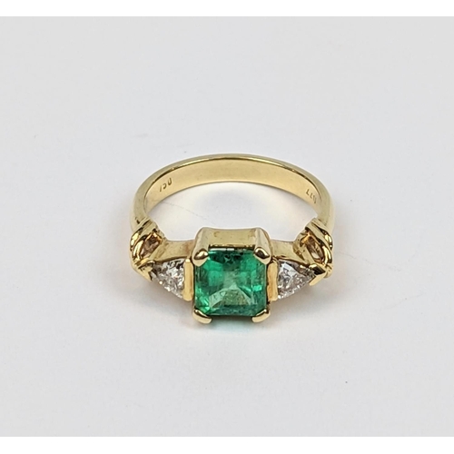 257 - Fine Ladies Square Cut Columbian Emerald claw set ring with Trilliant Cut shoulders. Central Emerald... 