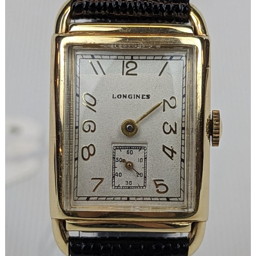 273 - Longines 14K Gold rectangular cased curved wristwatch with numeral face and second dial. Working Ord... 