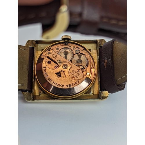 278 - Swiss made Omega dress watch with Art Deco stylings, in square tank form, rolled gold case. on Leath... 