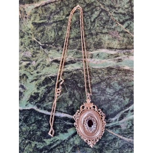 240h - 20thC 9ct Gold Almaldine garnet set Pendant with hinged back and Long link chain 9.8g total weight