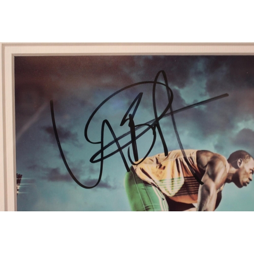 5 - Usain Bolt Signed Photographic Print framed and mounted. 42 x 49cm