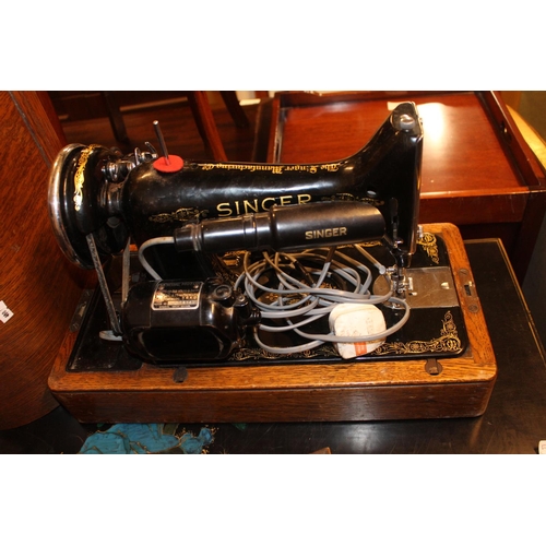 530 - Oak cased singer sewing machine