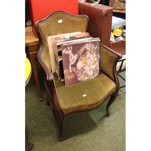 566 - Upholstered wooden framed chair with brass button decoration