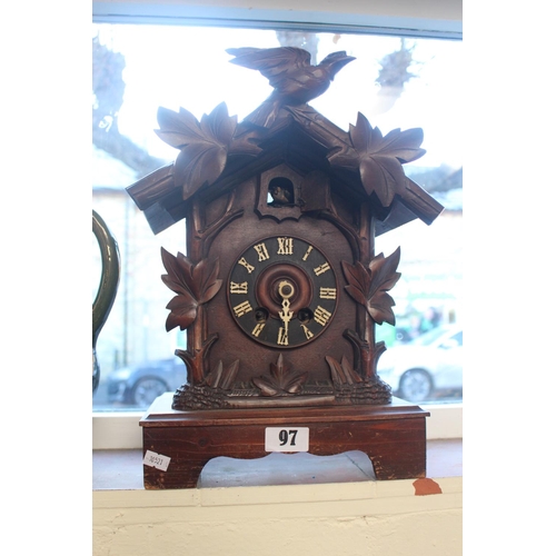 97 - Large Black Forest carved bracket clock with roman numeral dial