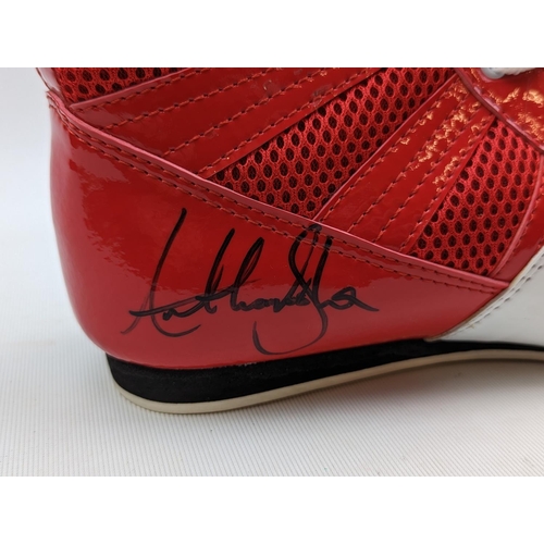 46 - Red Nike signed boxing boot by Anthony Joshua and a Picture of Joshua signing the boot