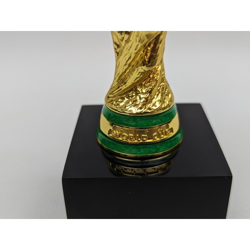 63 - An Official Russia 2018 FIFA World Cup miniature Trophy 14cm in Height Purchased from Juliens $500 R... 