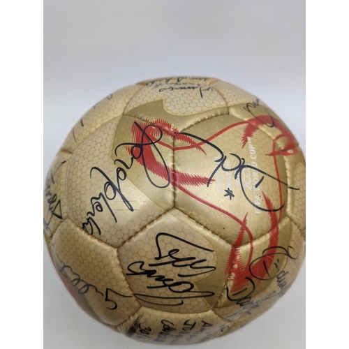 86 - 2002 FIFA World Cup gold ball signed by all the Brazilian Players, 30/6/02