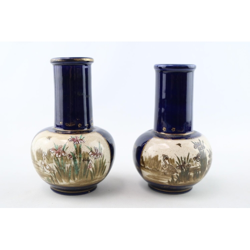 74 - Pair of Japanese Geisha decorated mantel vases and  similar Squat vases with character marks to base