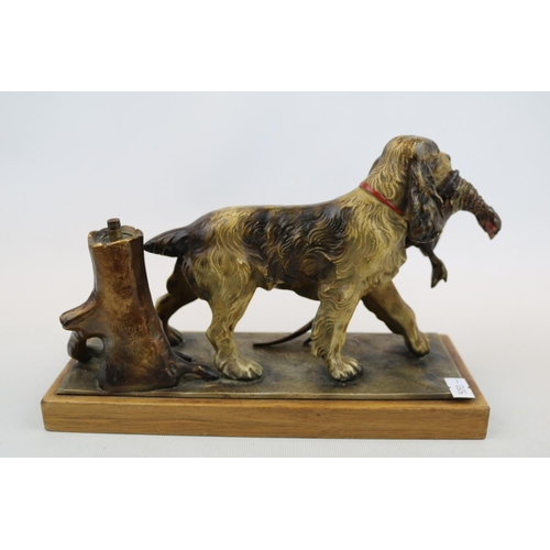 66 - Cold Painted table lighter in the form of a Springer Spaniel with Pheasant in mouth mounted on woode... 