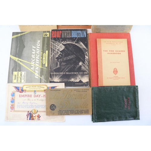 221 - Wartime booklets including Britain's Home Guard, Fire Guards handbook, ration book cover etc