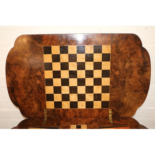 284 - Good quality Victorian games table with quartered veneer, inlaid to interior and sewing base over tu... 