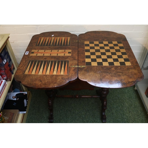 284 - Good quality Victorian games table with quartered veneer, inlaid to interior and sewing base over tu... 