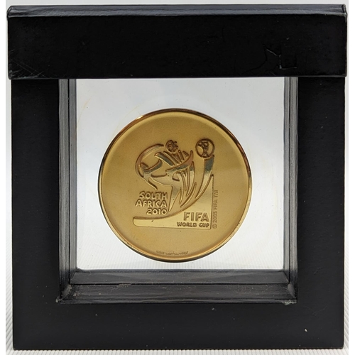 9 - Gold Tone participants medal presented during the 2010 FIFA World Cup in South Africa. The obverse o... 