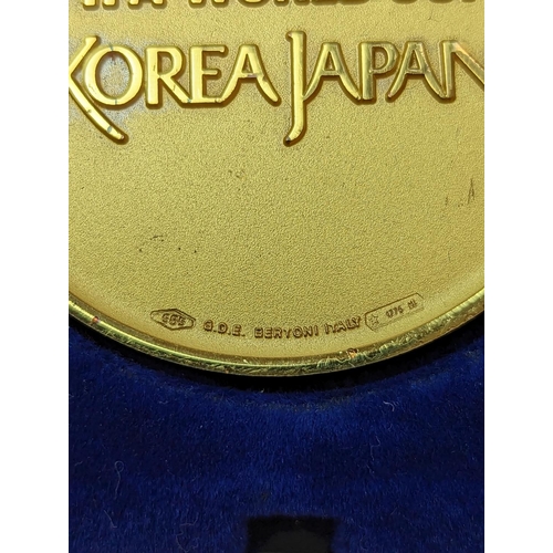 45 - 2002 World Cup winner's gold medal FIFA WORLD CUP, obverse with the Jules Rimet trophy in relief, in... 