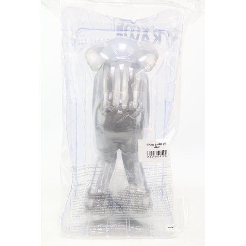 76 - Small Lie Companion by KAWS (AKA Brian Donnelly, b1974). Created in 2017 this grey open edition Comp... 