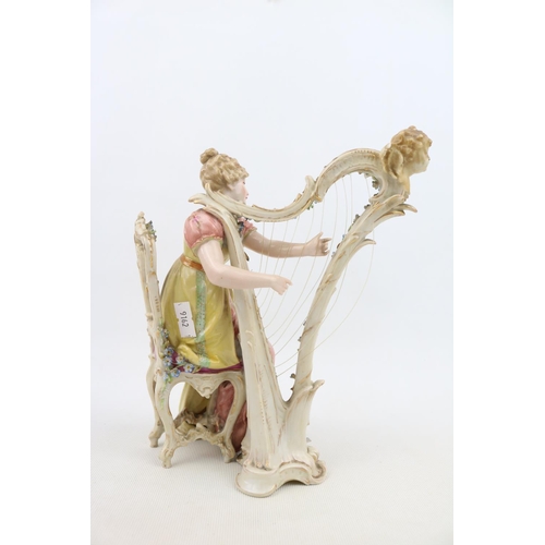 2 - European Bisque porcelain figure of a woman playing a Harp with scrolled mark to base and Arrow blue... 