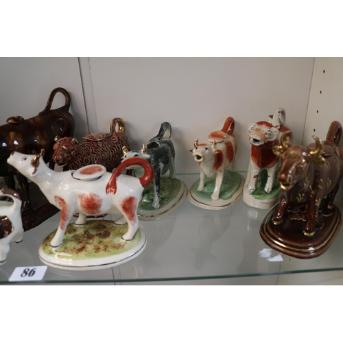 86 - Collection of 13 19thC and later Cow Creamers