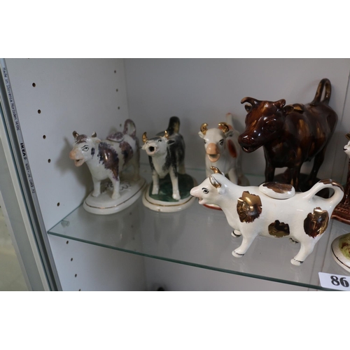 86 - Collection of 13 19thC and later Cow Creamers