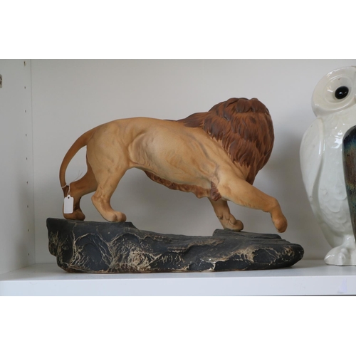 1 - Beswick porcelain figure of a Lion on rocky outcrop