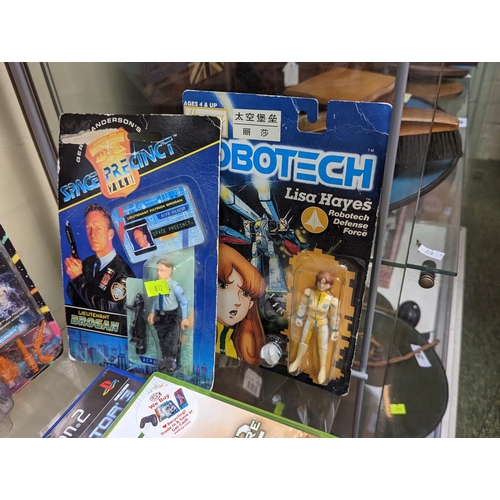 15 - 2 Carded Star Trek Next Generation figures, Space Precinct figure, Robotech figure and 2 Video Games