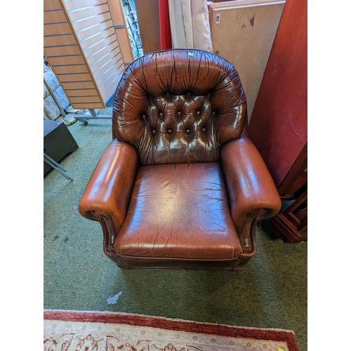 324 - Brown Leather button back Elbow chair