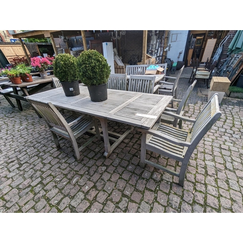 371 - Large Hardwood Garden Table and Seven chairs