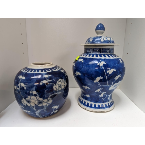 60 - Chinese Blue and White Prunus decorated 4 character lidded jar and a Chinese Prunus Ginger jar with ... 