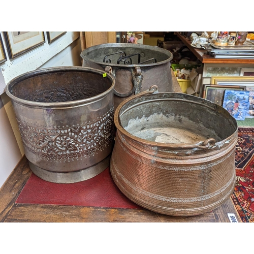 79 - 2 Middle eastern Copper cook pots and a Middle eastern floral decorated Jardinière