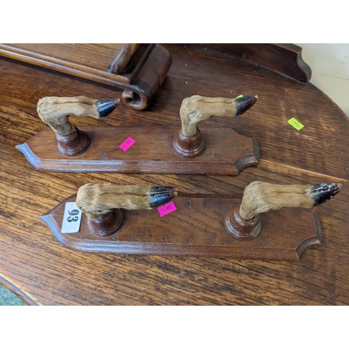 93 - Pair of Door hoof hangers mounted on wooden bases